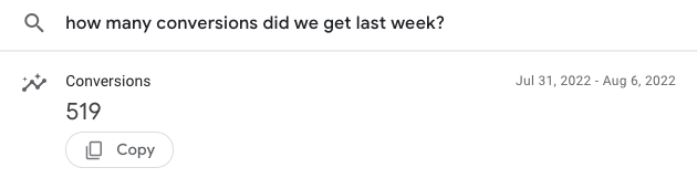 Example of a search box query asking "how many conversions did we get last week?" with the answer showing as 519