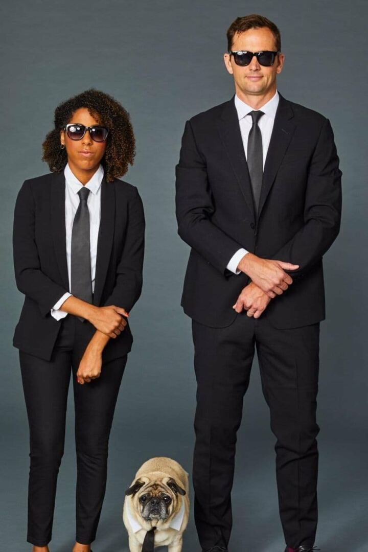 Two people dressed as the Men in Black