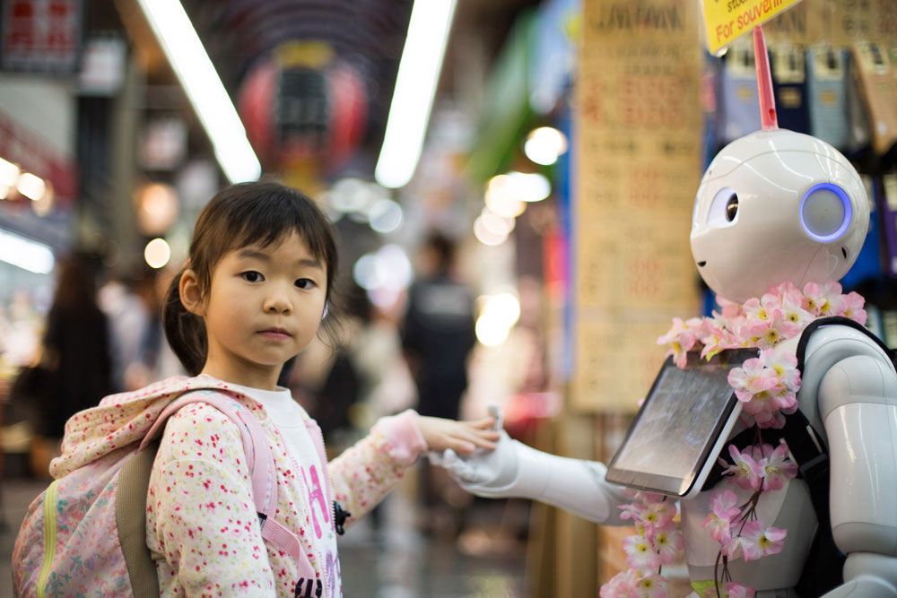 will ai replace us girl shaking hands with robot