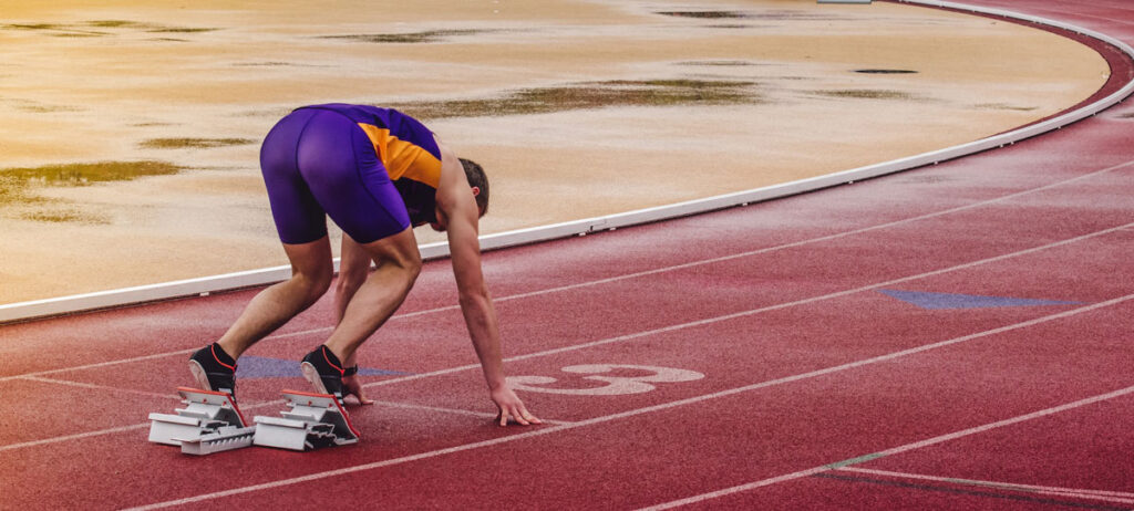 runner on starting blocks symbol for first input delay