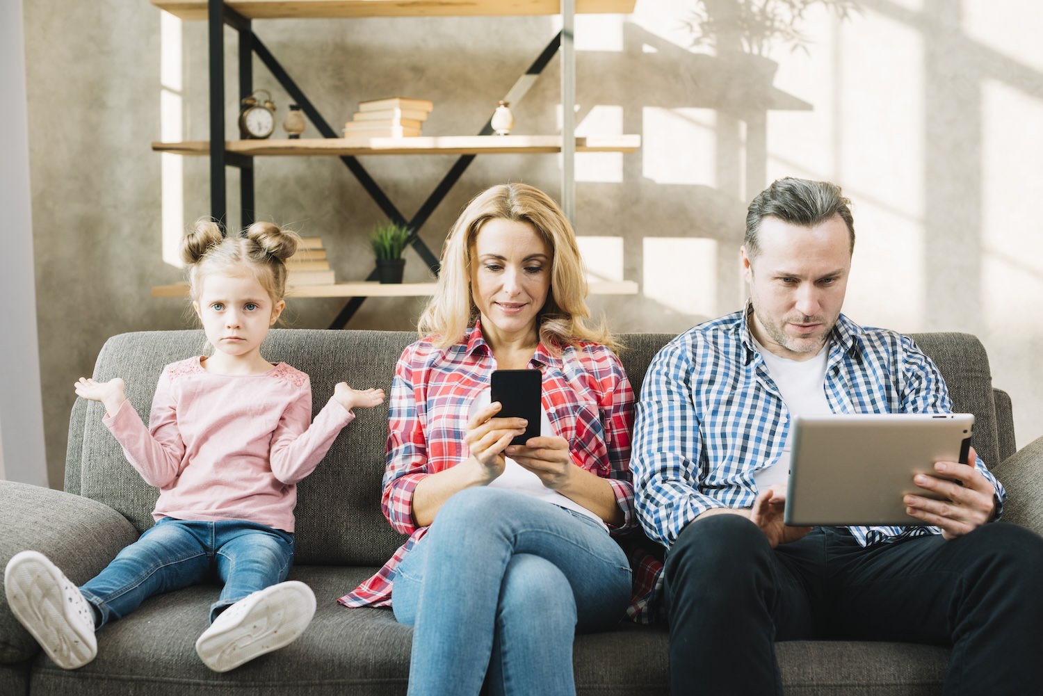 parents with mobiles ignoring child