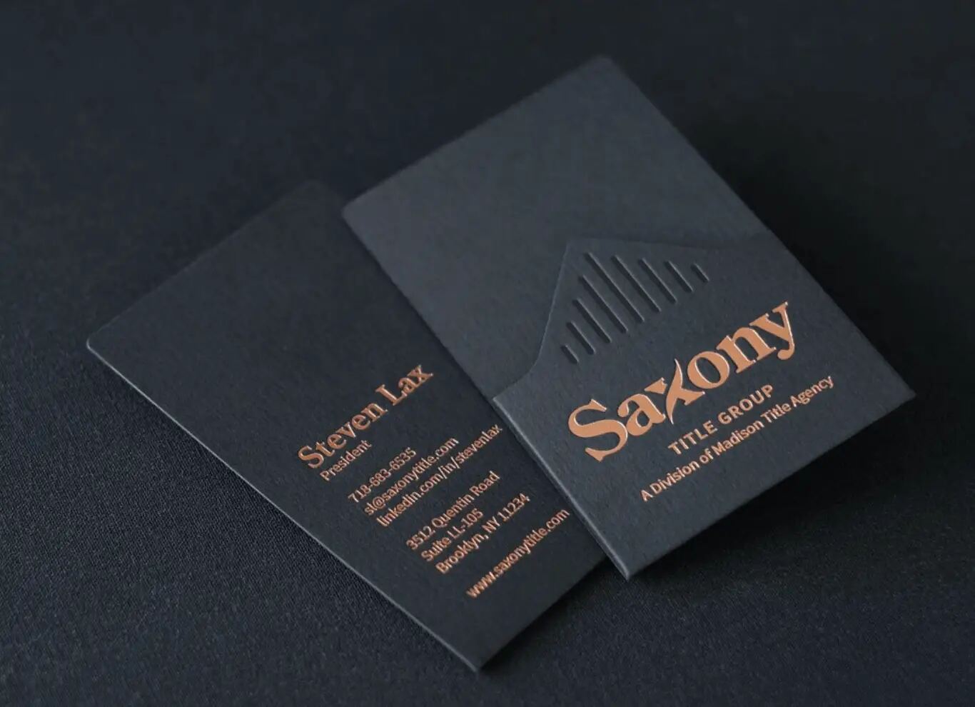 A business card with embossed lettering.