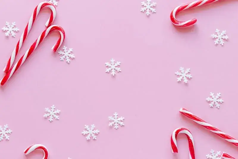 candy sticks zoom backgroundhttps://www.pexels.com/photo/red-and-white-stripes-candy-canes-on-pink-surface-5868960/